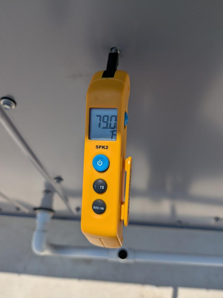 Temperature probe documenting rooftop HVAC air reading