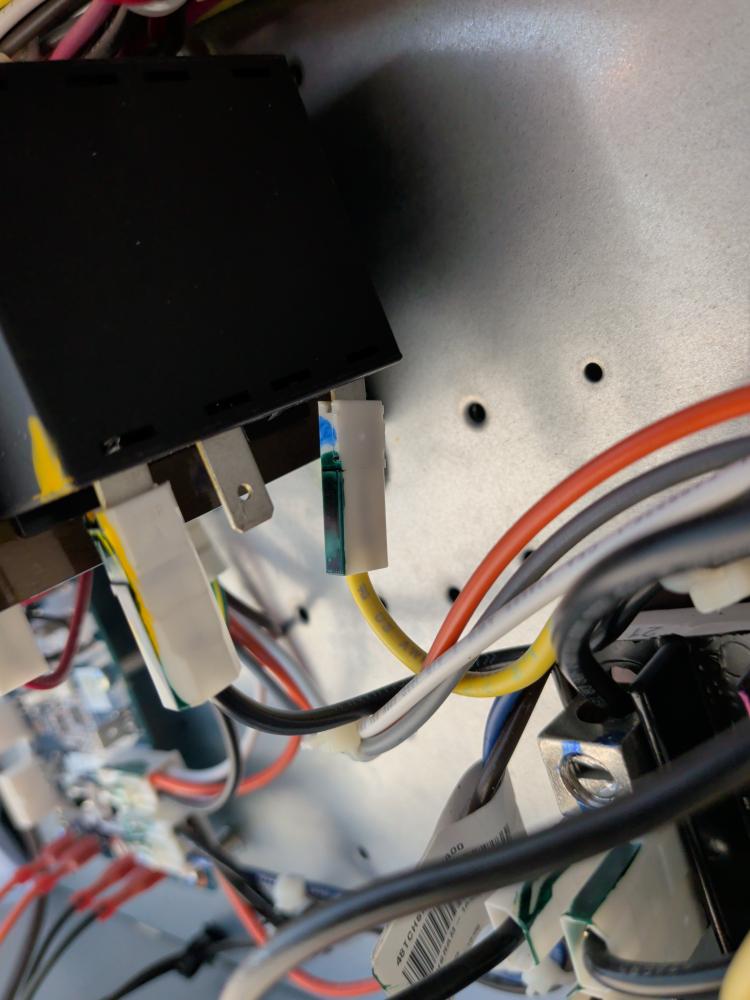 Commercial rooftop unit wiring compartment under inspection