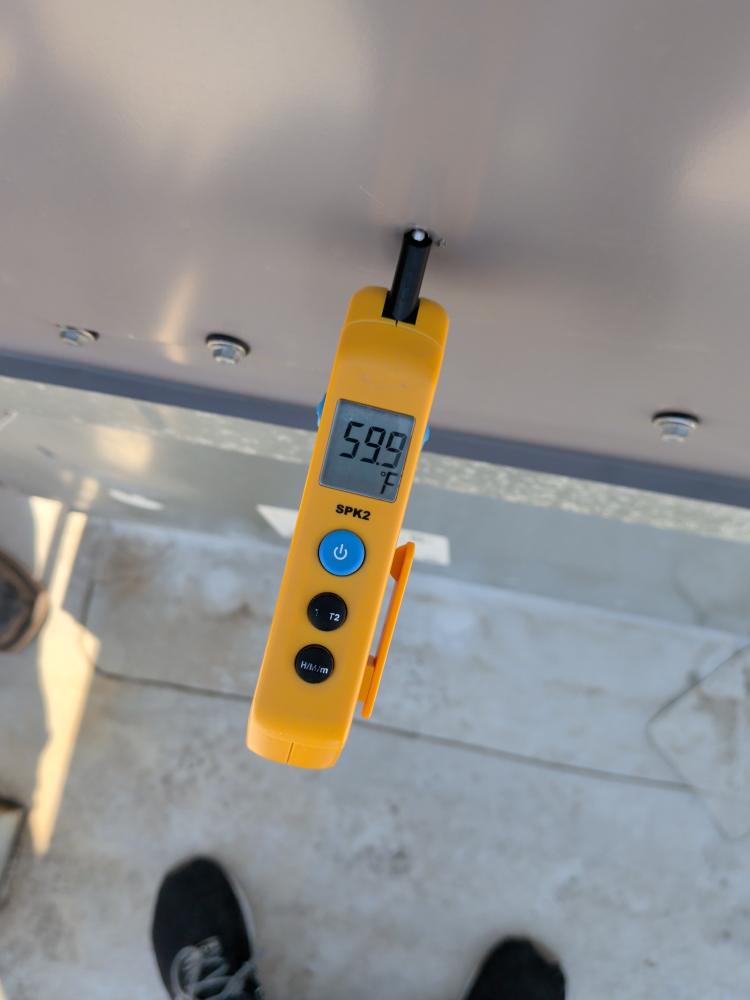 Supply air temperature probe during North Austin HVAC service