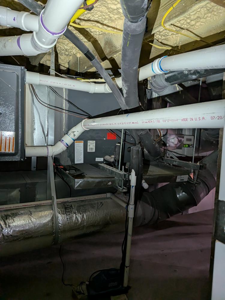 Concealed Goodman air handler installed above ceiling