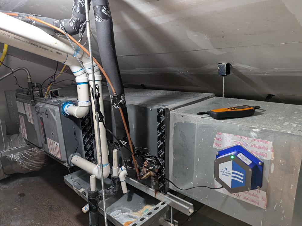 Goodman indoor HVAC unit with condensate and refrigerant piping