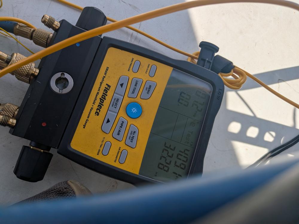 Nitrogen pressure test instrument connected to rooftop unit